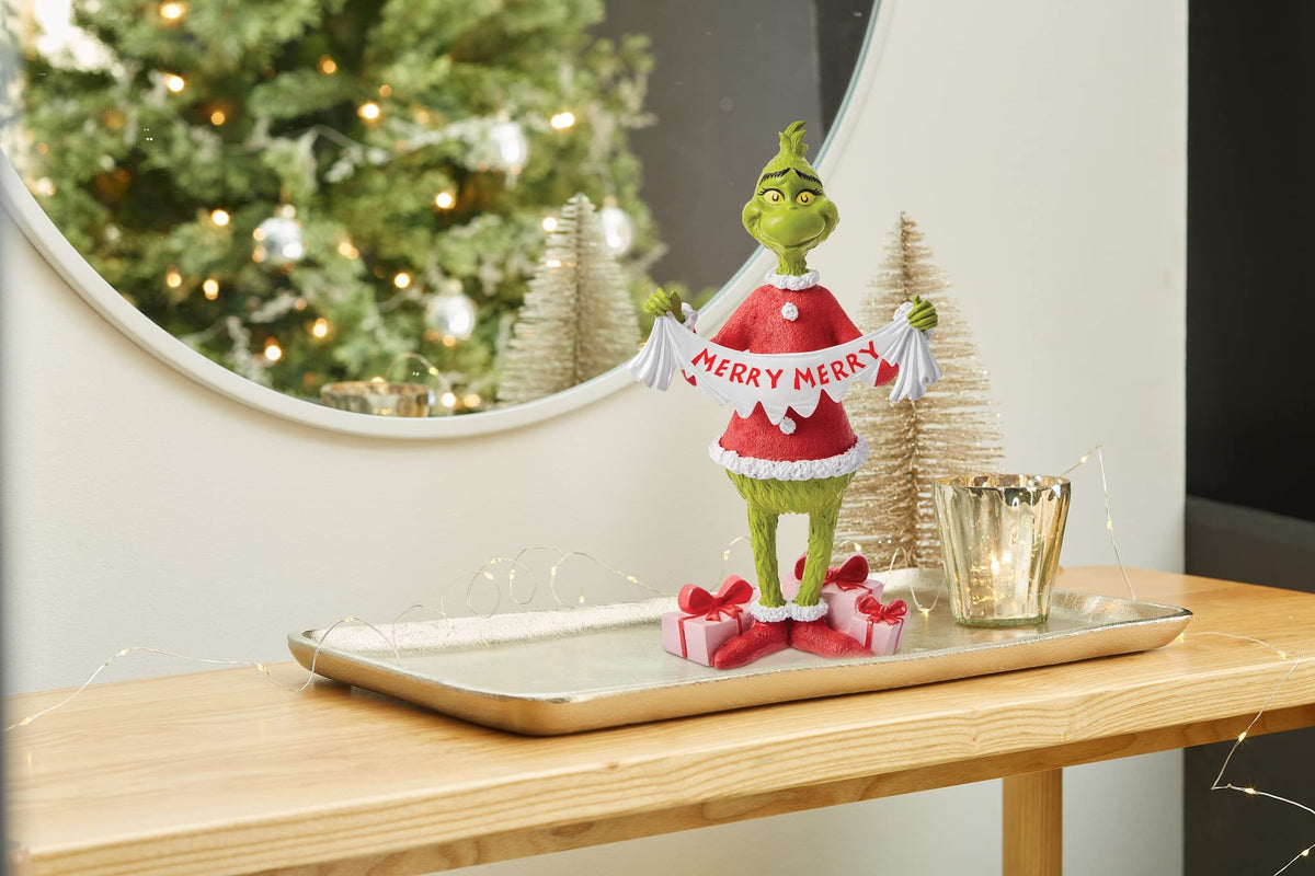 Department 56 Dr. Seuss The Grinch Holding Merry Christmas Banner Figurine, 8.875 Inch, Multicolor
